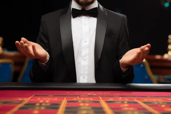 A cheerful woman in traditional clothing using her smartphone during a festive moment, showing how easily the 866JL app fits into everyday life.