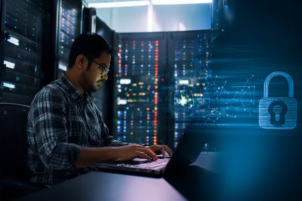 A woman smiling while playing online games on her laptop, surrounded by neon casino elements, showcasing 866JL’s diverse game collection.