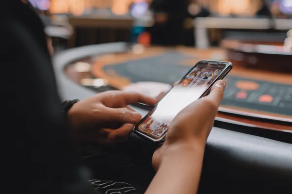 A dramatic shot of winning sevens landing on a slot reel surrounded by shining gold coins, symbolizing big wins.